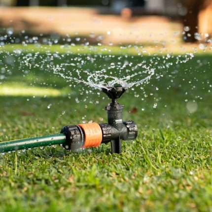 Holman ECO Rotating Lawn Sprinkler with adjustable arms and 360° spray pattern for lawns and gardens